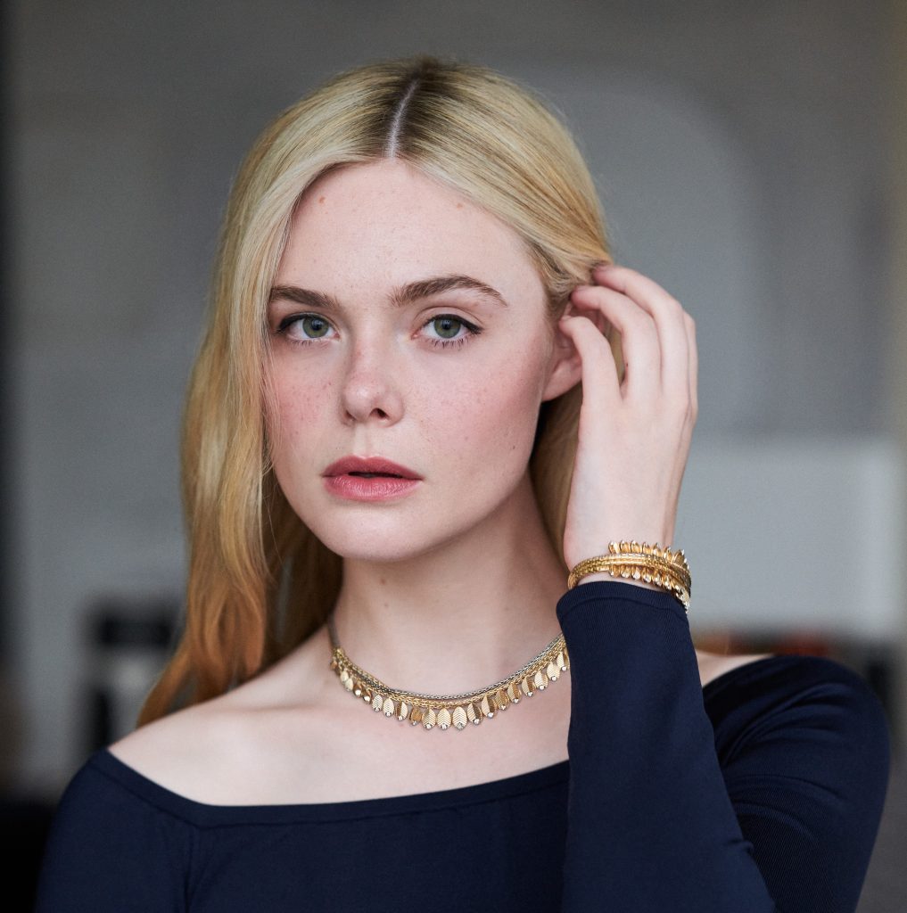 Debuting as the global ambassador and new face of Cartier's Grain de Café collection, Elle Fanning attends Met Gala wearing the iconic design